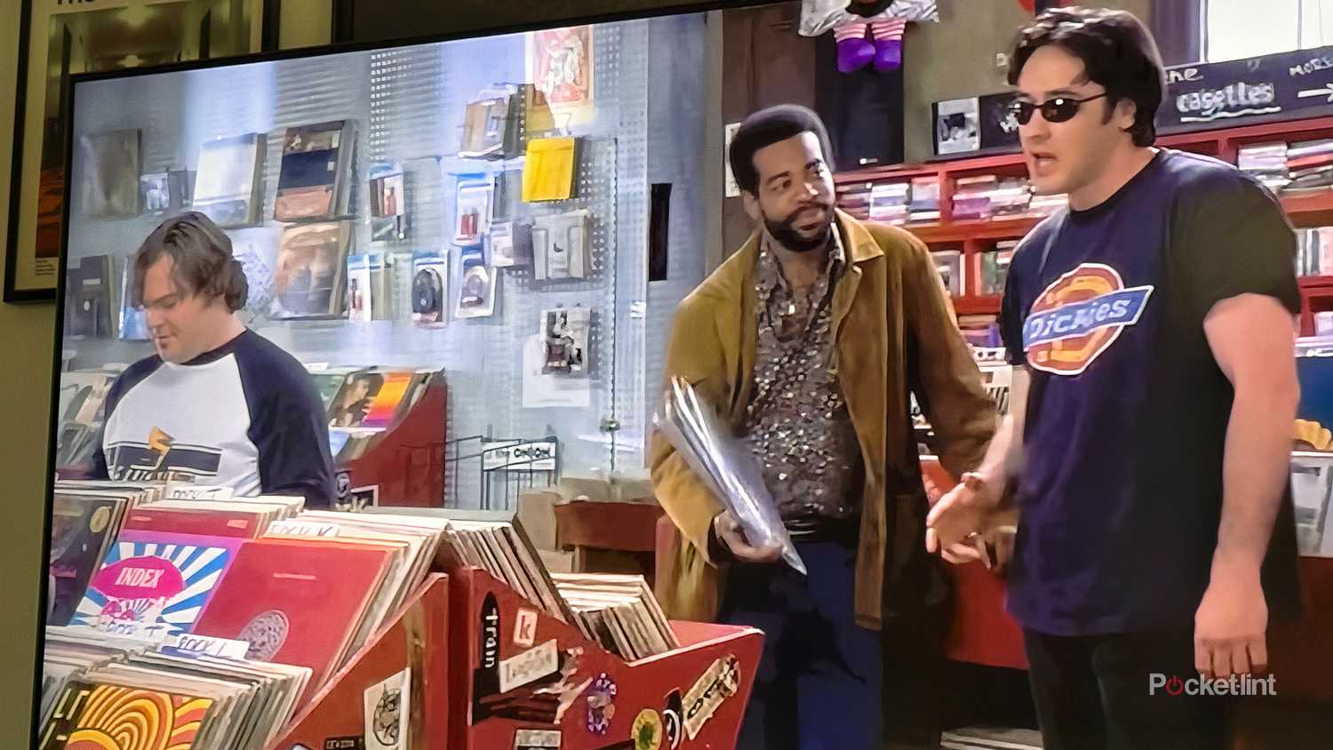 TV screen with scene from High Fidelity playing.