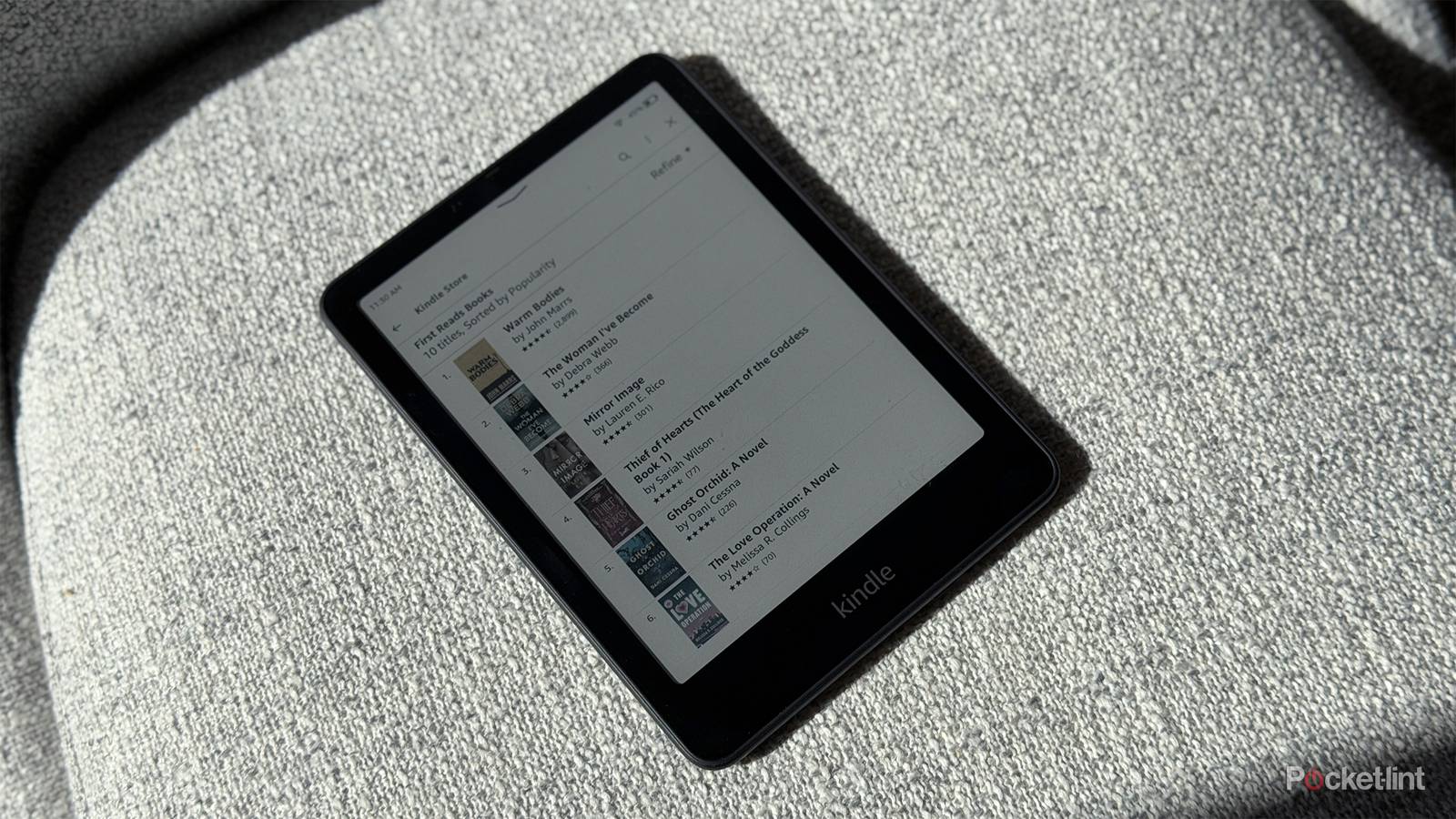 Kindle Colorsoft on a chair.
