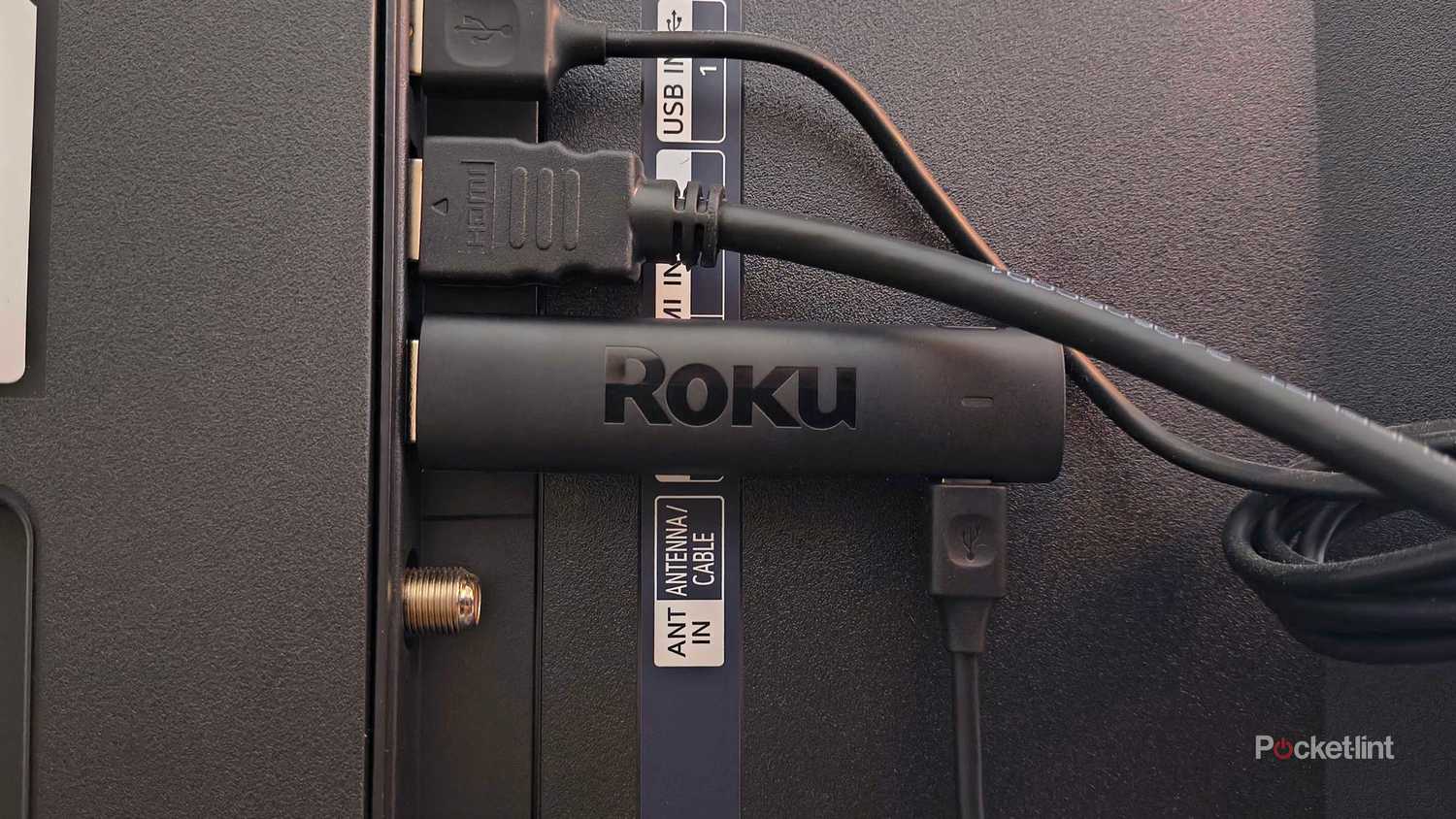 Roku Streaming Stick 4K plugged into TV.