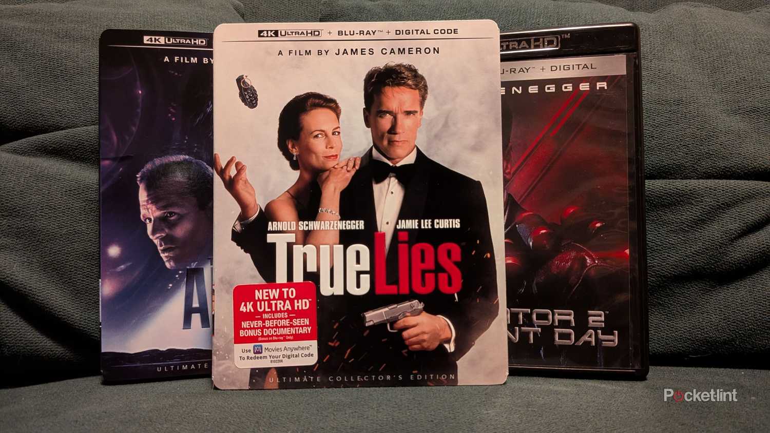 True Lies in front of The Abyss and Terminator 2 on a couch.