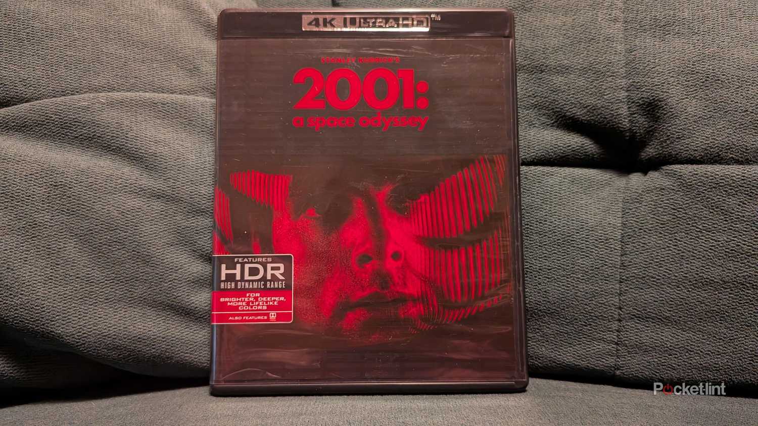 2001: A Space Odyssey 4K Blu-ray displayed on a couch.