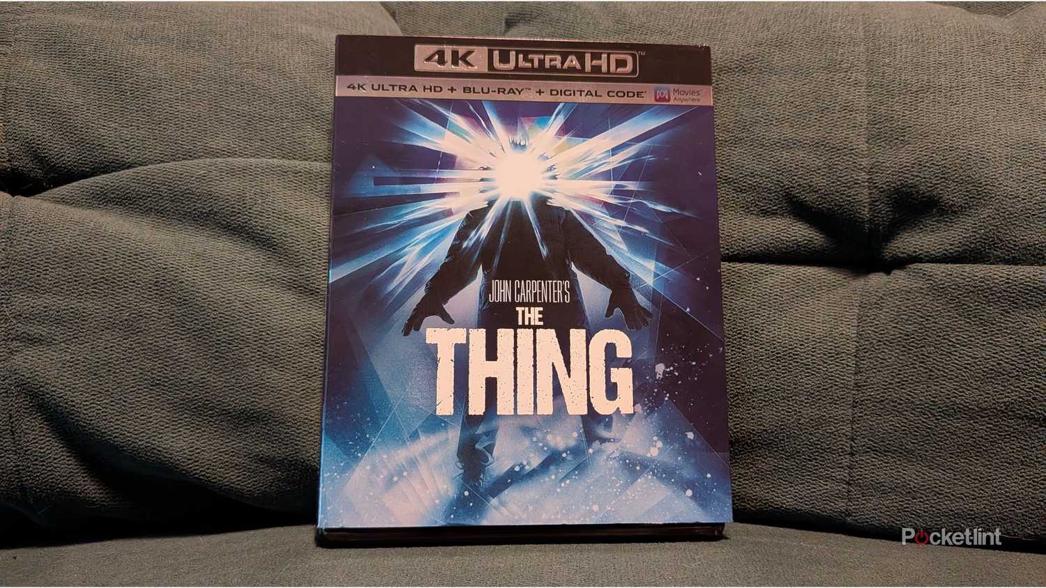 The Thing 4K Blu-ray on a couch.