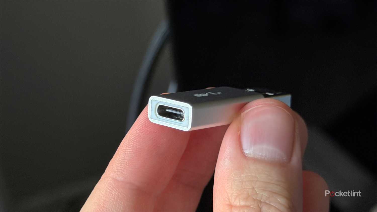 Person holding USB-C adapter.
